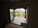 Folding patio doors opening to a view of Mesa area mountains